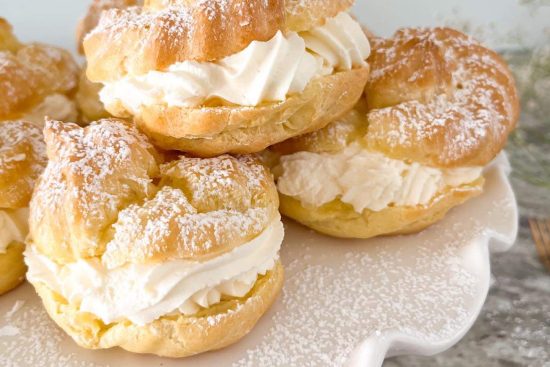 Cream Puffs filled with Mascarpone cream, displayed on white cake stand