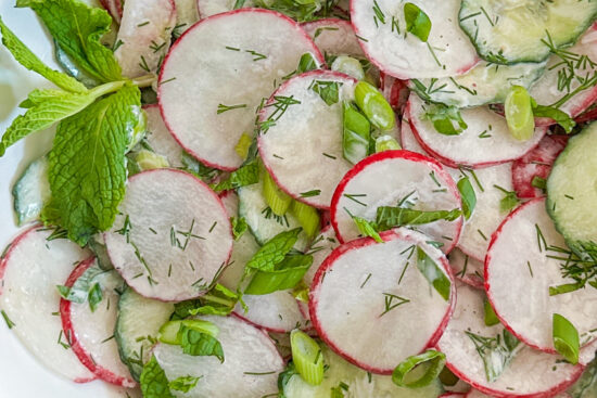 Full of crisp radishes and cucumbers, tossed in a creamy dressing with fresh dill, green onions, and mint.